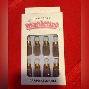 Manicure Gold tip long press on nails with shimmer nude base